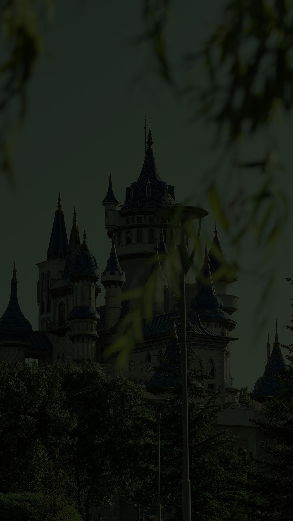 Castle with multiple towers and spires symbolizing the regal elegance of the Noble collection by Fabled Fox Clothiers.